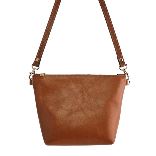 Front view of the Porta Leather Ava Crossbody Bag in Tan with Gold hardware 