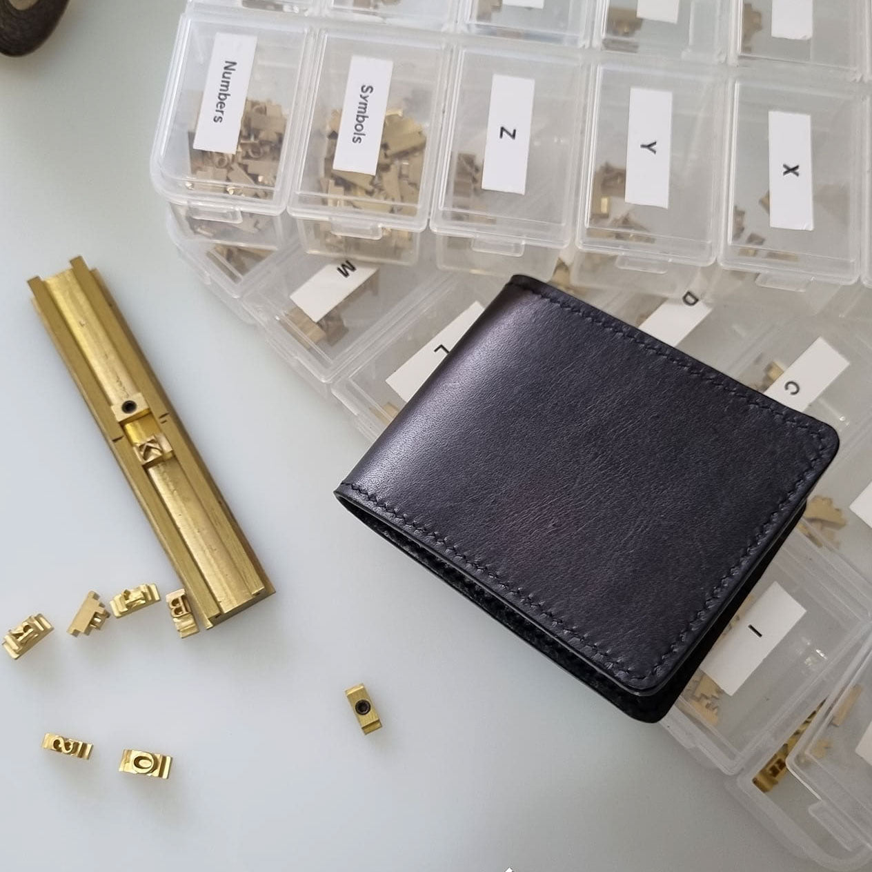 Wallet and personalisation stamping tools to add monogrammed name or initials to leathergoods.