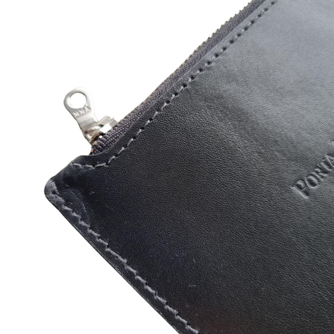 Close up of the Porta Leather Bella Pouch in Black leather with silver hardware.