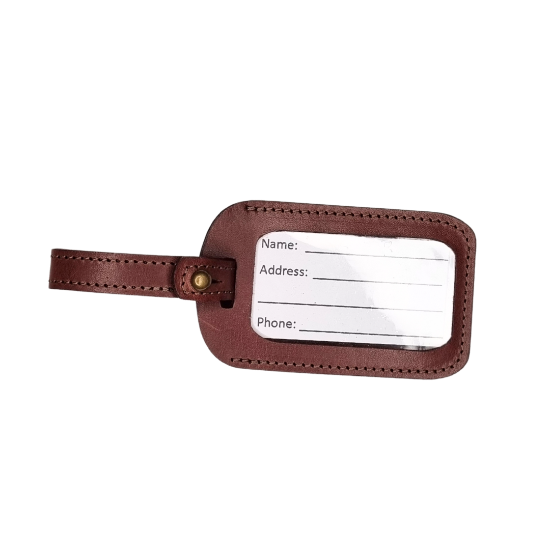 Window view of Porta Leather's brandy luggage tag