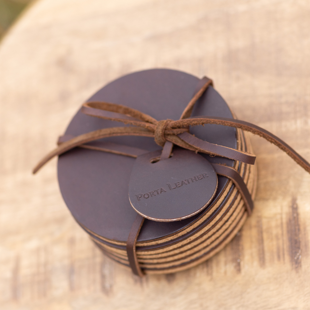6 pack of round Porta Leather coasters in brown and packaged
