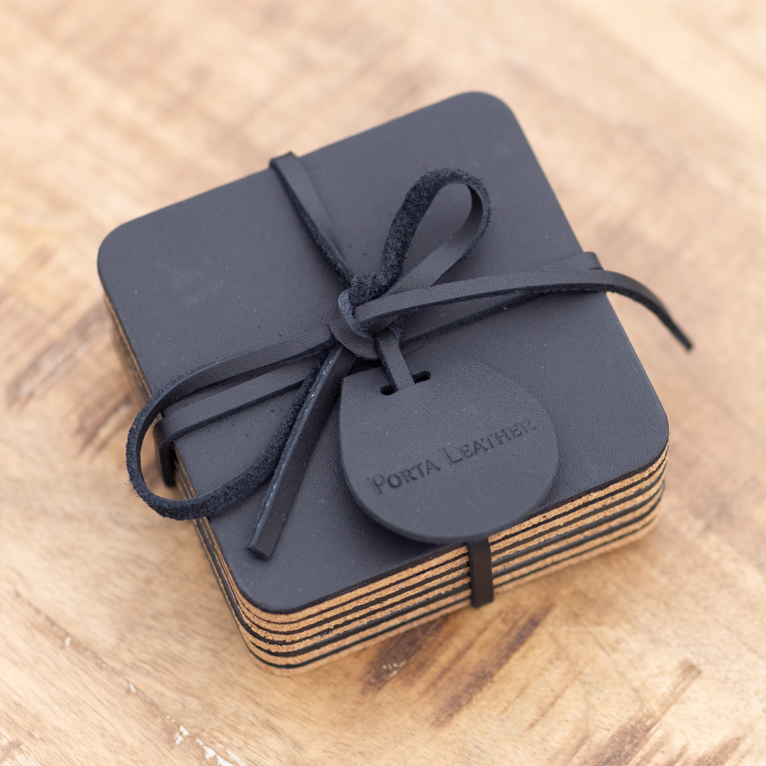 Packaged pack of 6 square black coasters