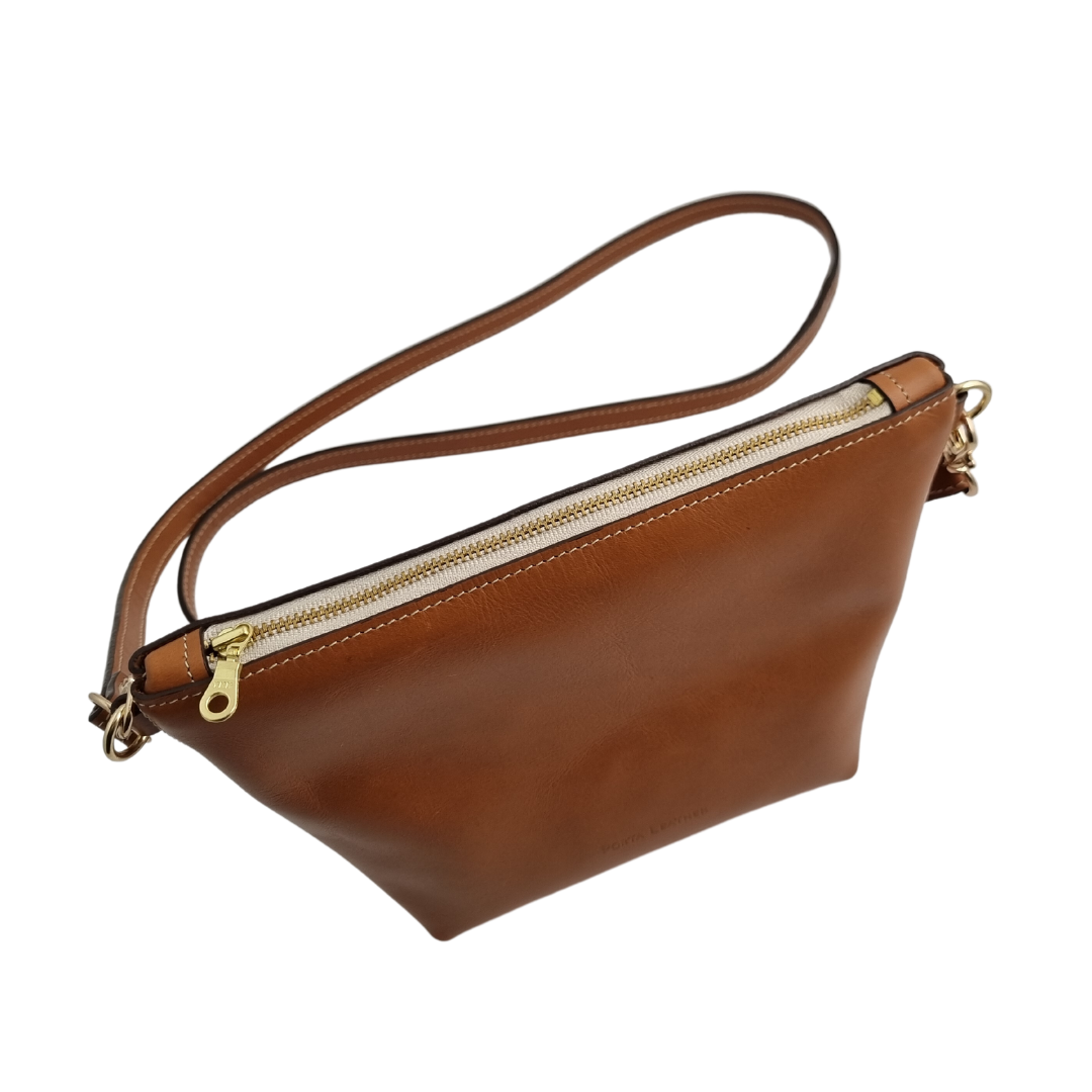 Top view of the Porta Leather Ava Crossbody Bag in Tan with Gold Hardware