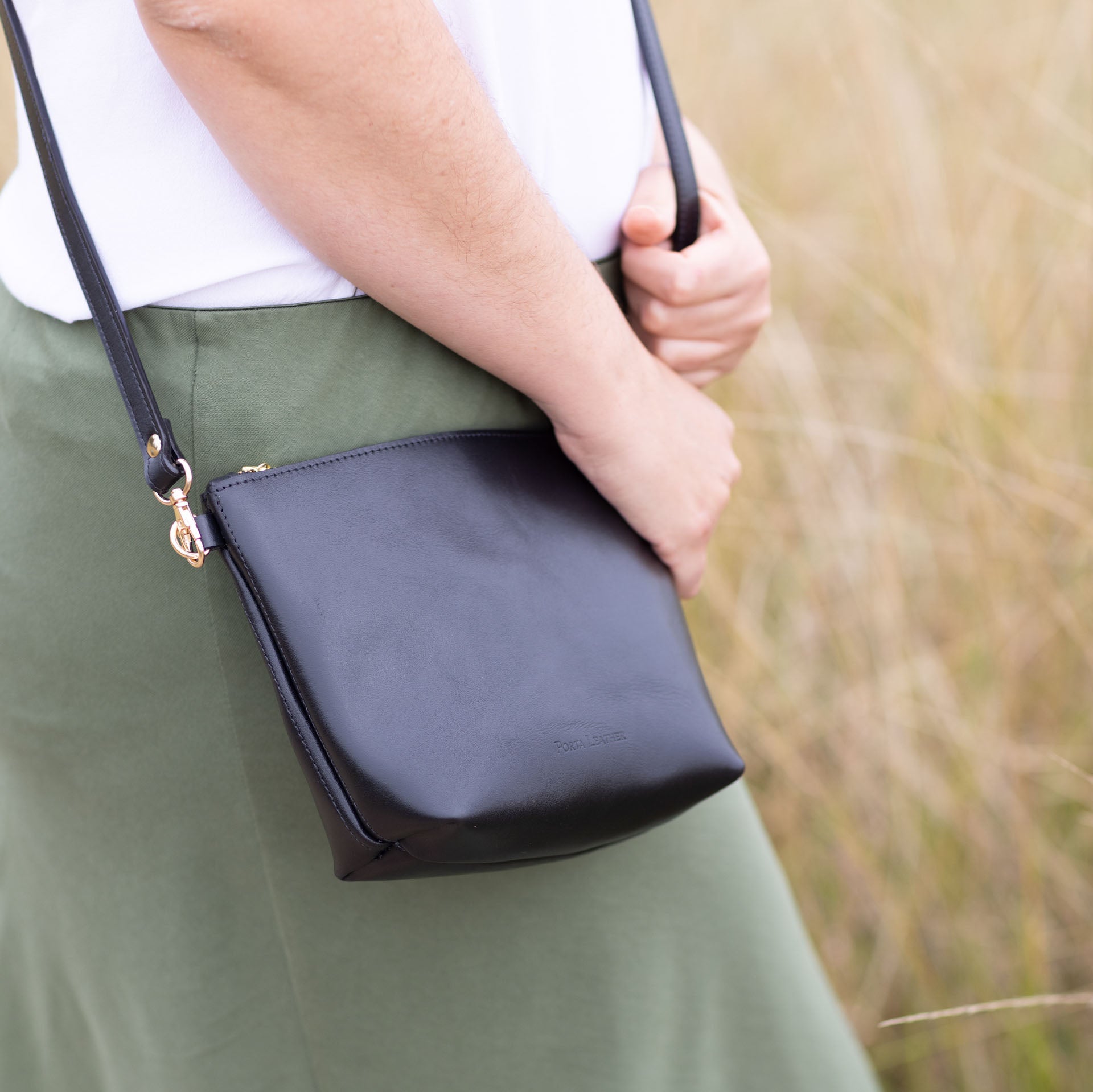 Black Porta Leather Ava Crossbody Bag with gold hardware