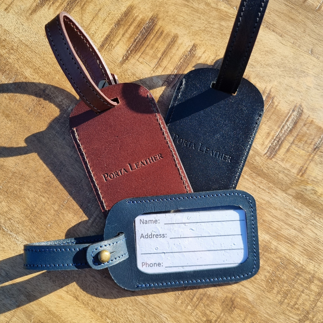 Porta Leather's luggage tags in black, Brandy and navy
