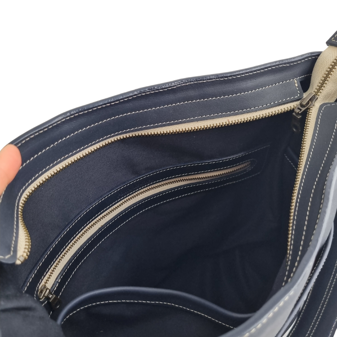 Inside view of Porta Leather essential crossbody bag in navy