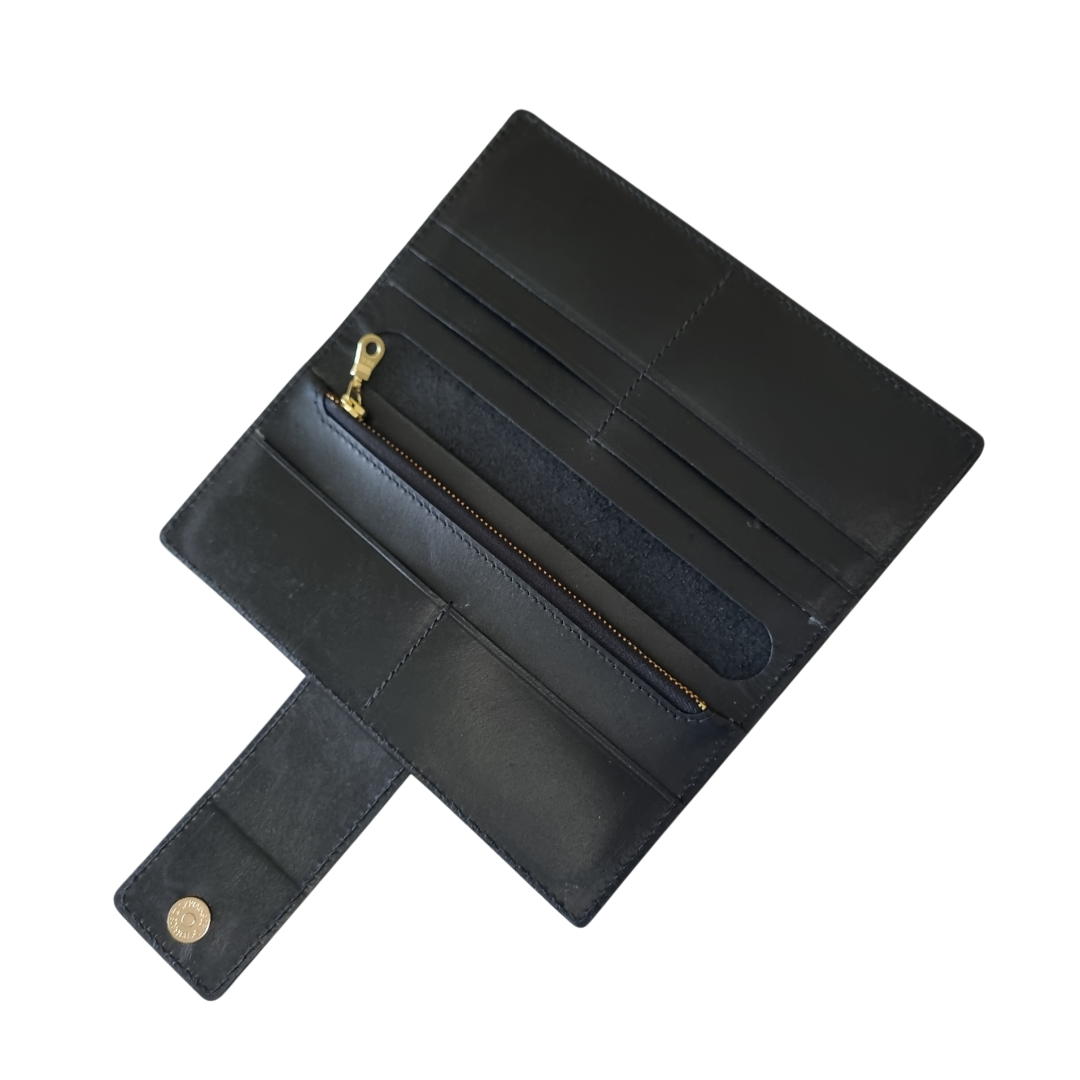 Long wallet interior in black leather with gold hardware by Porta Leather