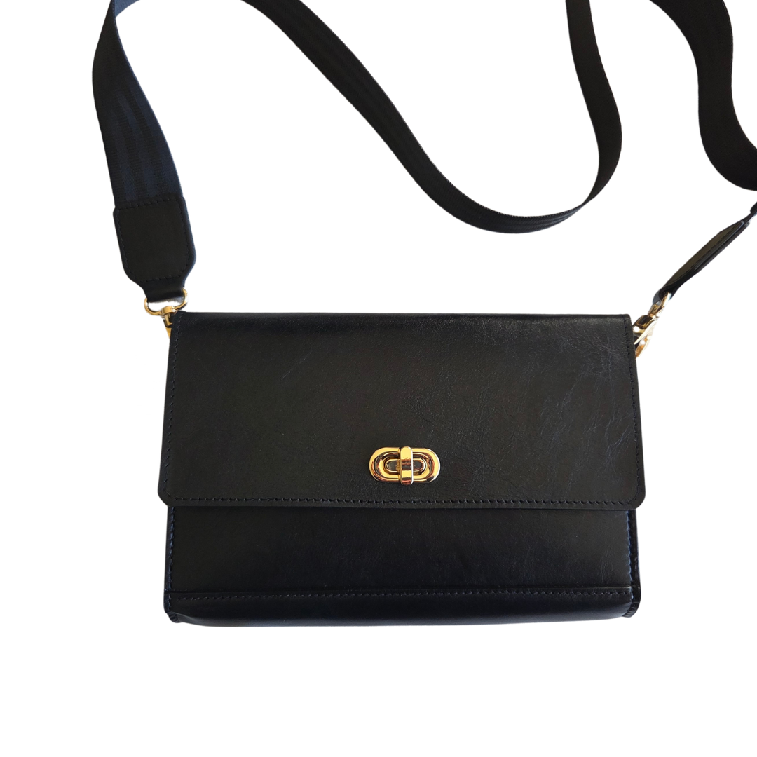 Porta Leather black Jenna Bag with a gold clasp on a white background with crossbody strap