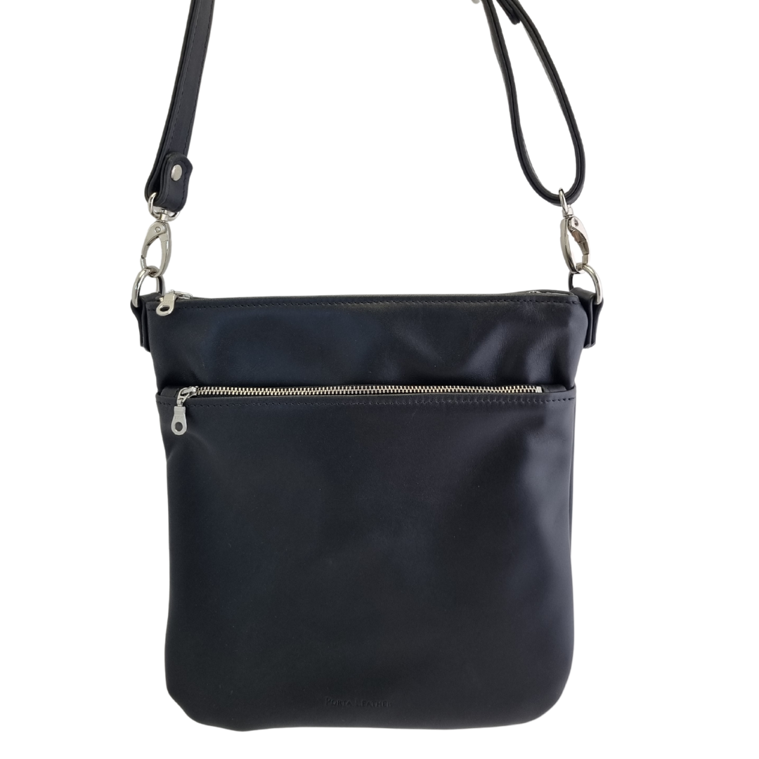 Front view of the Porta Leather handcrafted Harper Crossbody Bag in Black with silver hardware