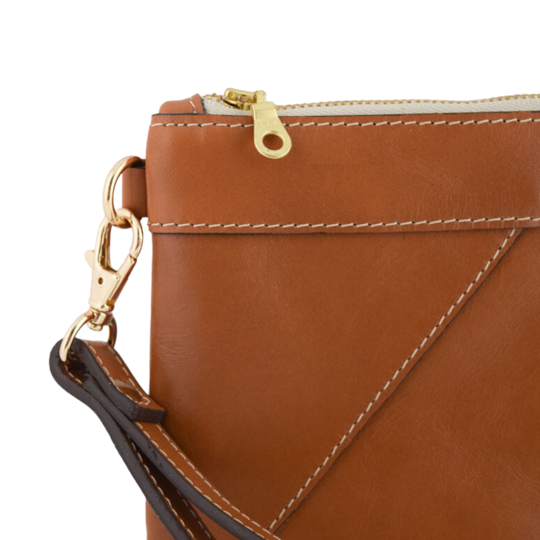 close up of Porta Leather Wristlet Clutch in tan and gold