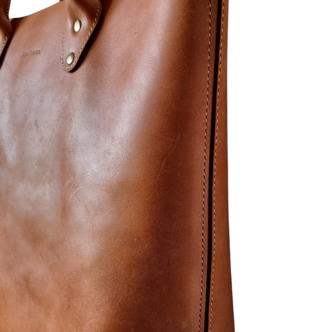 Side view of details on Porta Leather Heritage Tote bag